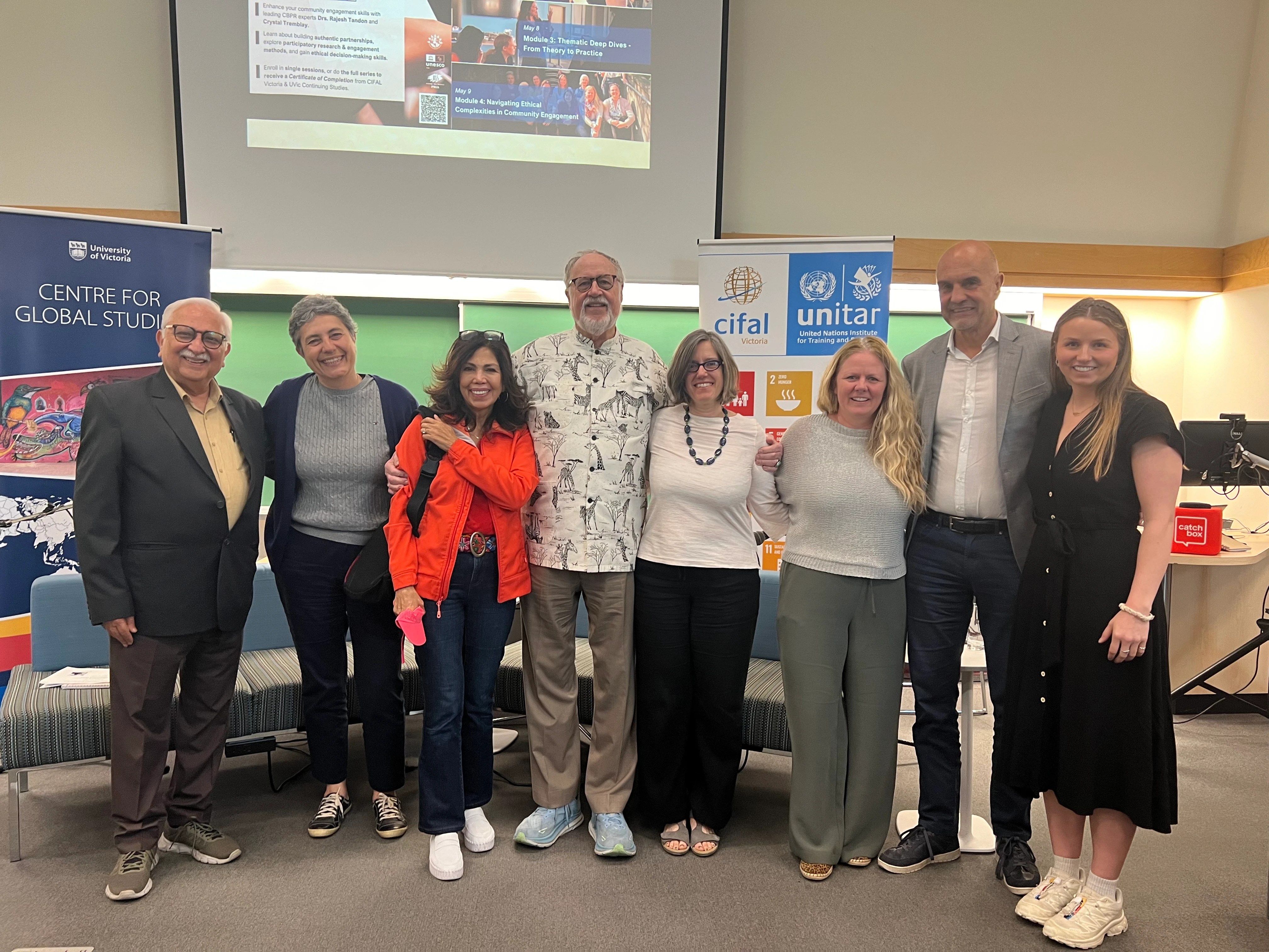 Rajesh Tandon, Budd Hall, and their collaborators from University of Victoria staff and professors pose together after holding a lecture in April 2025.